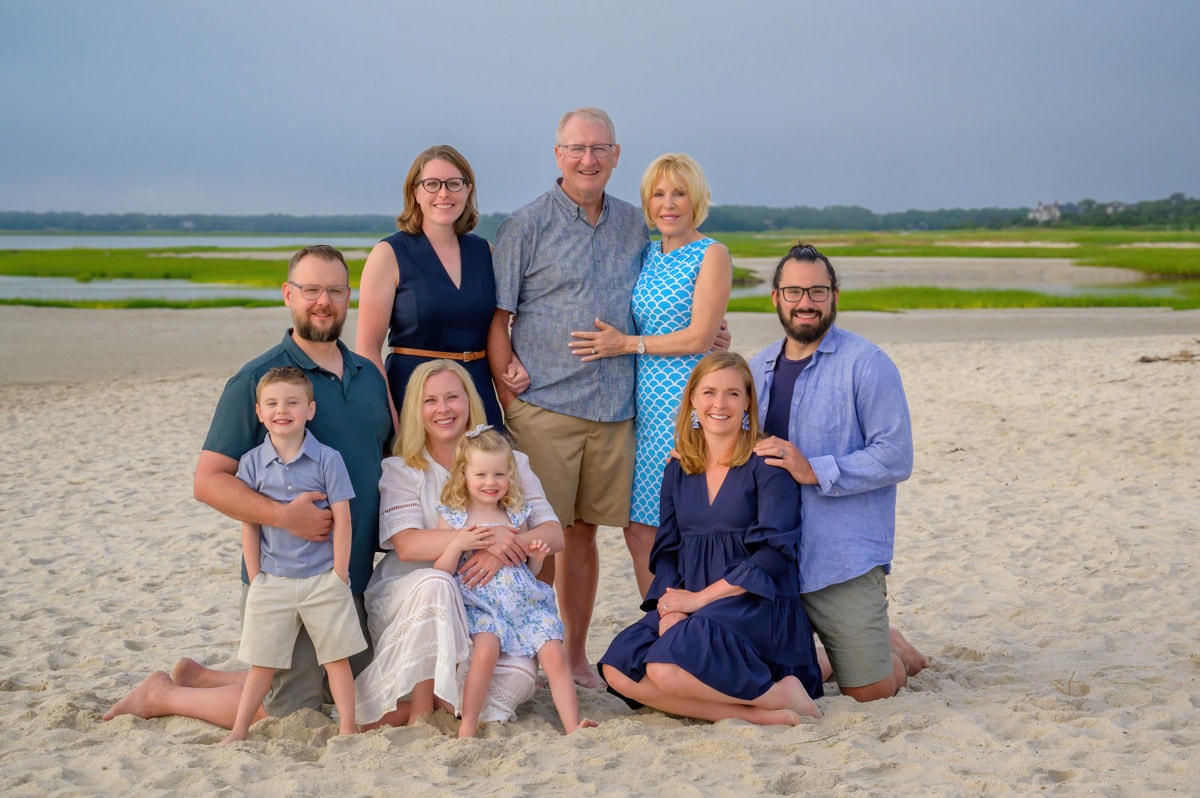 family posing on skaket beach in orleans on cape cod