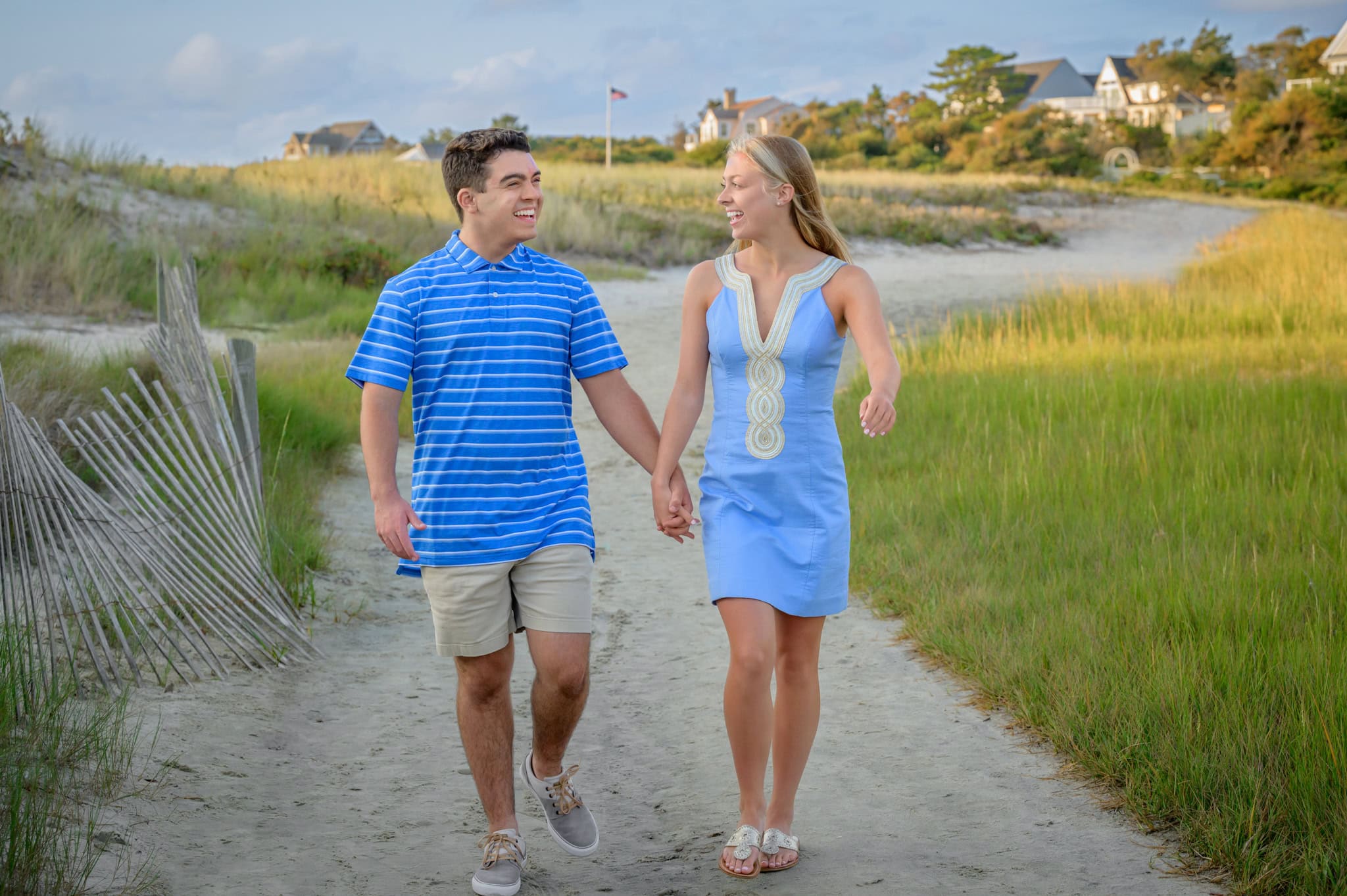 senior boy and girl twins at Woodneck high school senior twins walking along the path behind Wood Neck Beach in Falmouth