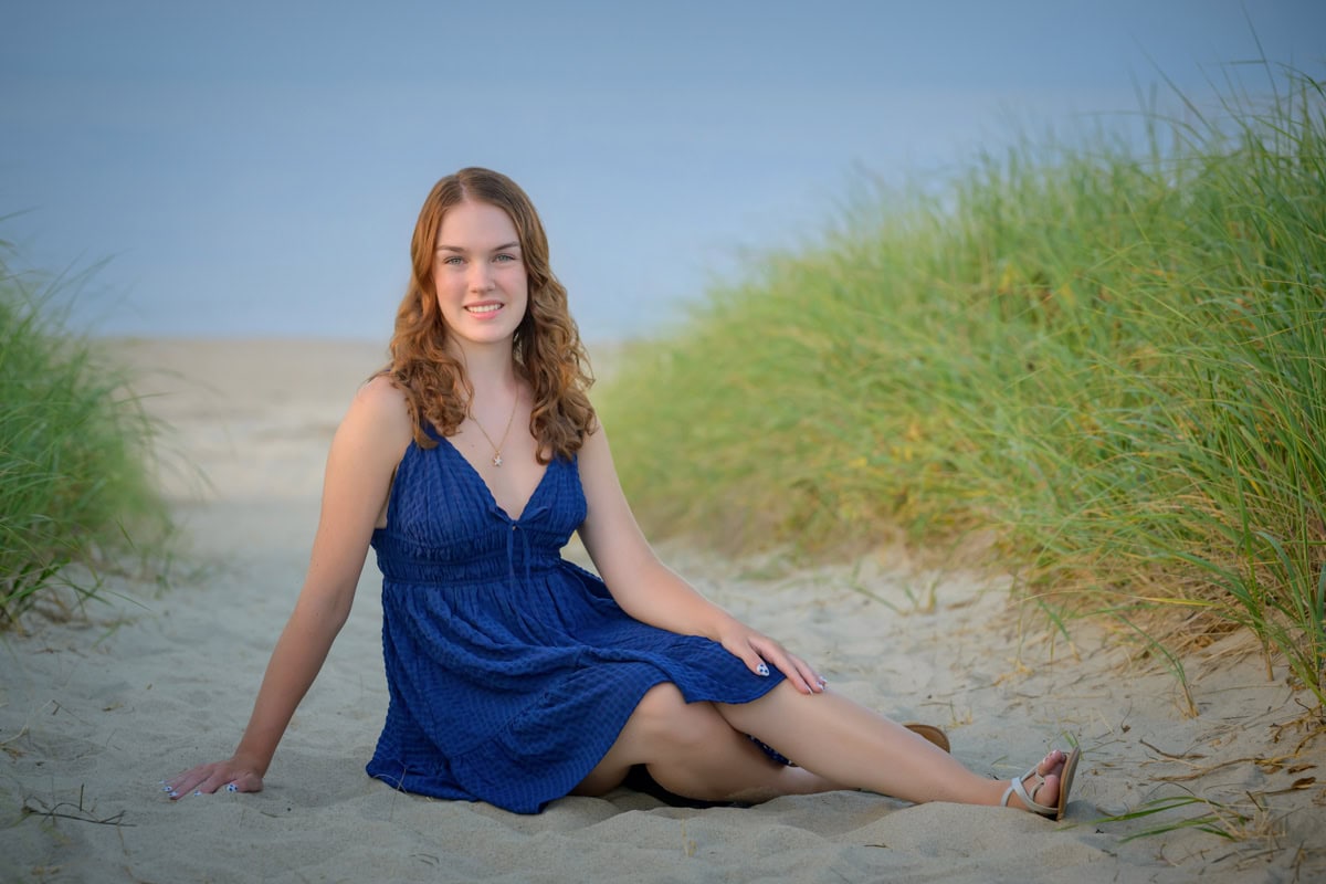 high school senior girl posing in dunes of a cape cod beach for senior portraits