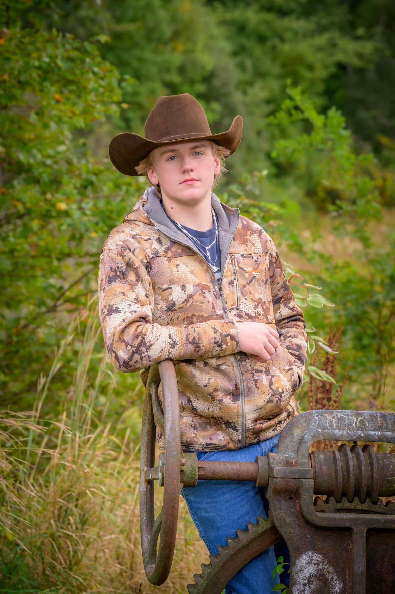 senior boy at a park for his senior pictures in wareham, ma